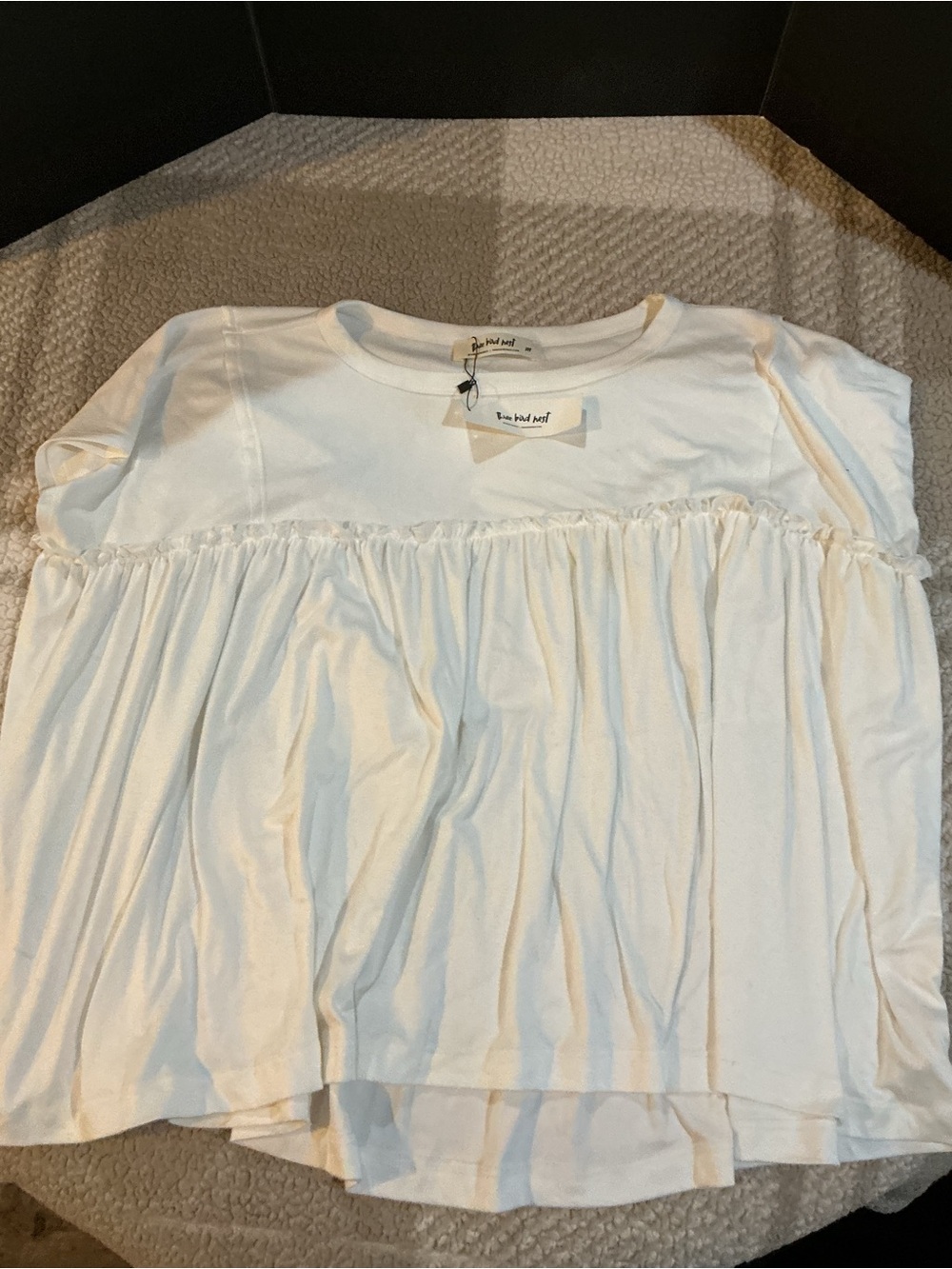 Woman’s White Ruffled Swing Top by Three bird nest